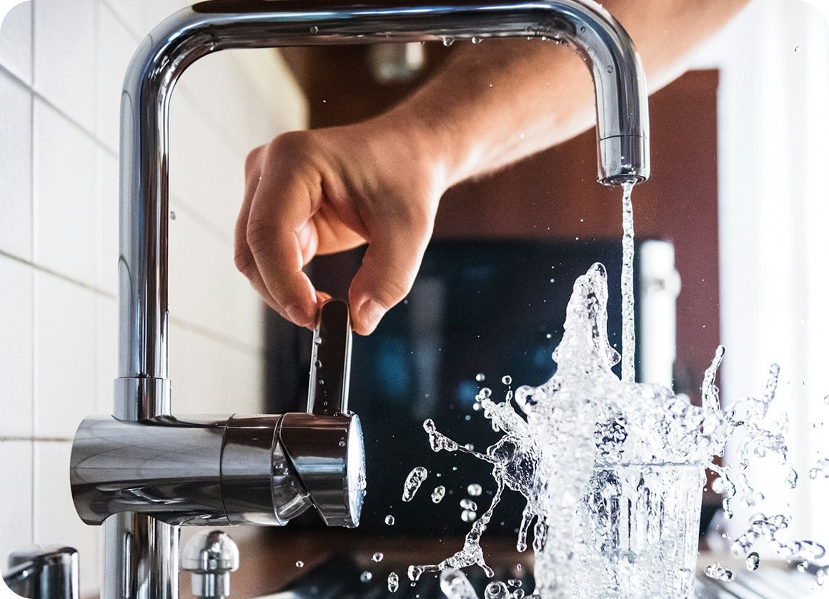 Water running from a kitchen tap being turned on