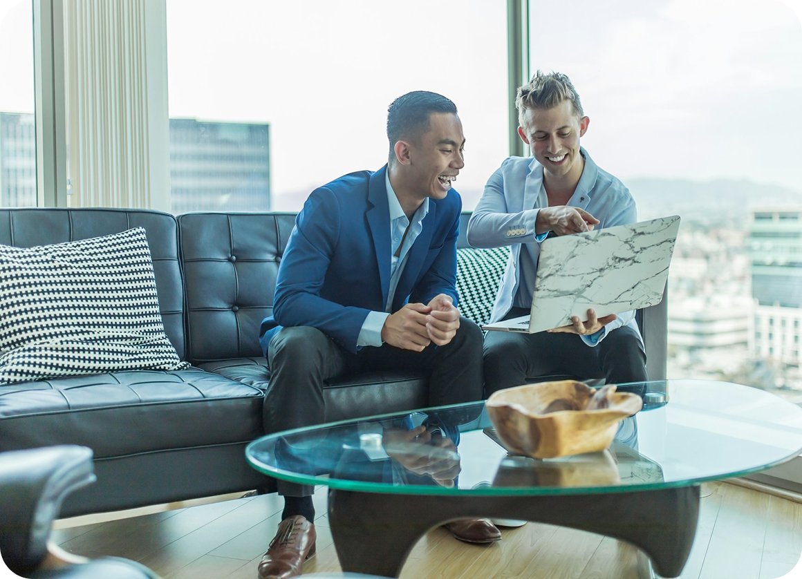 Estate agents going through listings with a client